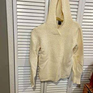 Tan sweater hooded and lines going down front